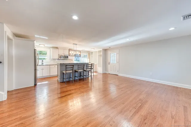 a view of a kitchen with dining table and chairs