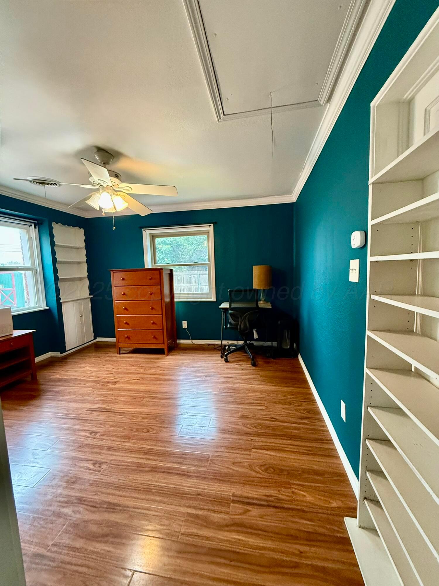 3314 Kingston Road Amarillo, TX 79106 - Photo 12 of 17 a room with wooden floor and furniture
