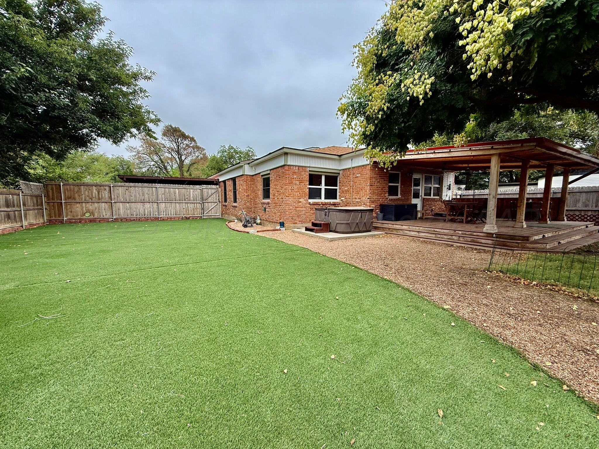3314 Kingston Road Amarillo, TX 79106 - Photo 16 of 17 a view of a house with a yard and sitting area