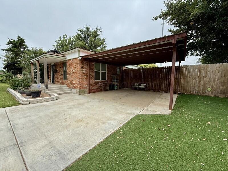 3314 Kingston Road Amarillo, TX 79106 - Photo 17 of 17 a view of a house with a backyard