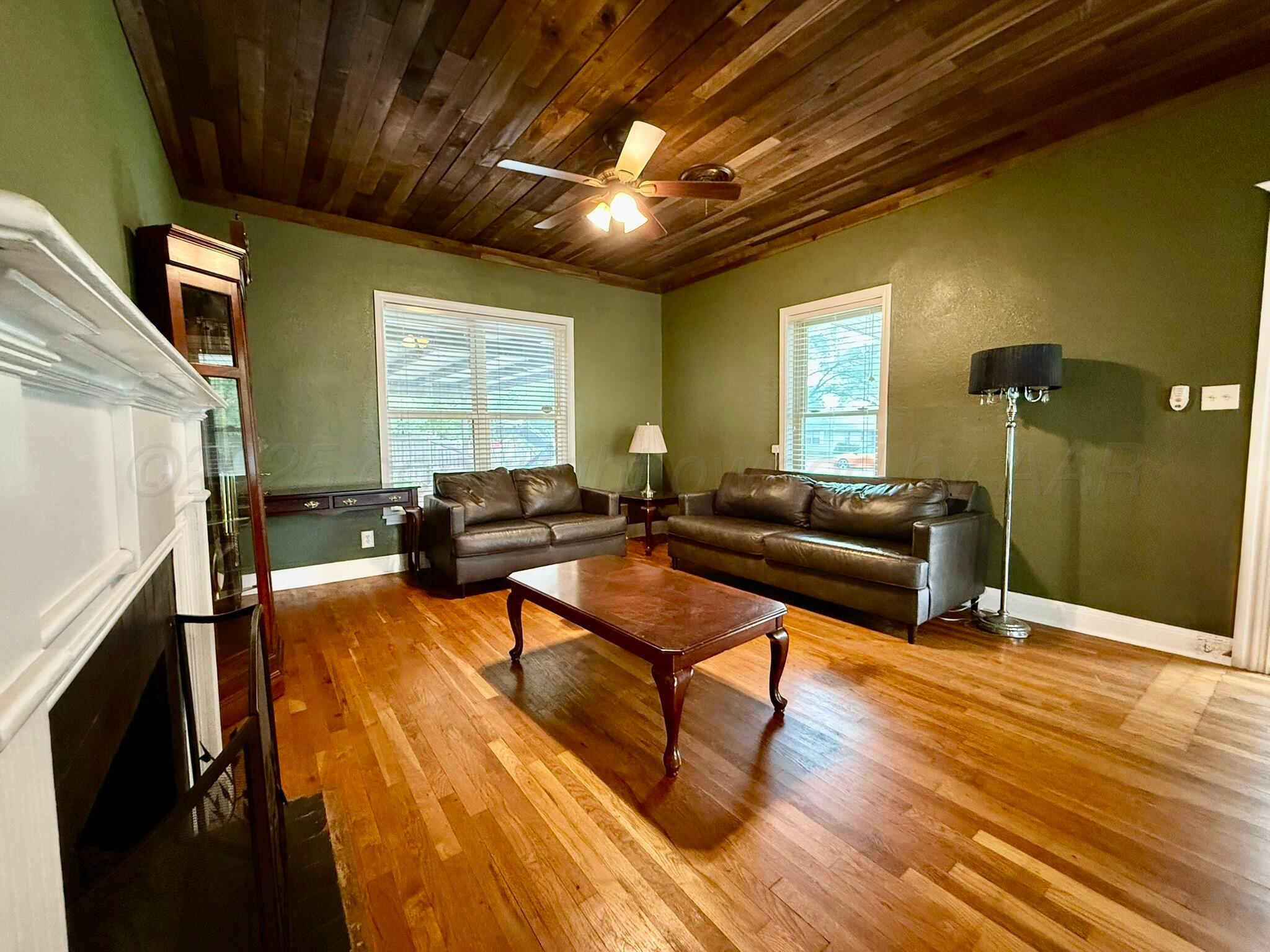 3314 Kingston Road Amarillo, TX 79106 - Photo 2 of 17 a living room with furniture and a wooden floor