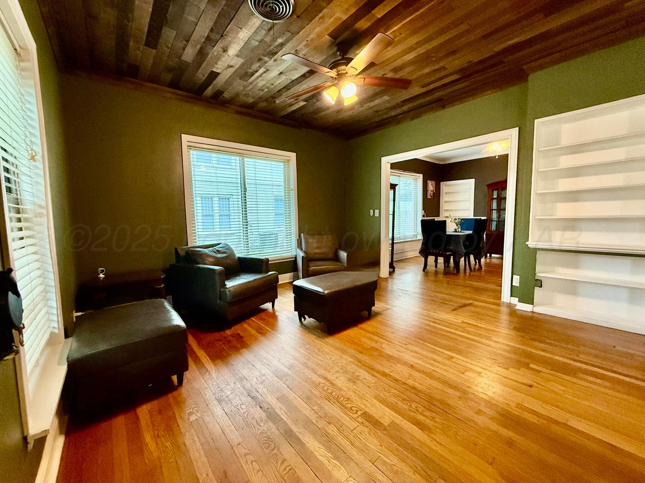 3314 Kingston Road Amarillo, TX 79106 - Photo 3 of 17 a living room with furniture and a wooden floor
