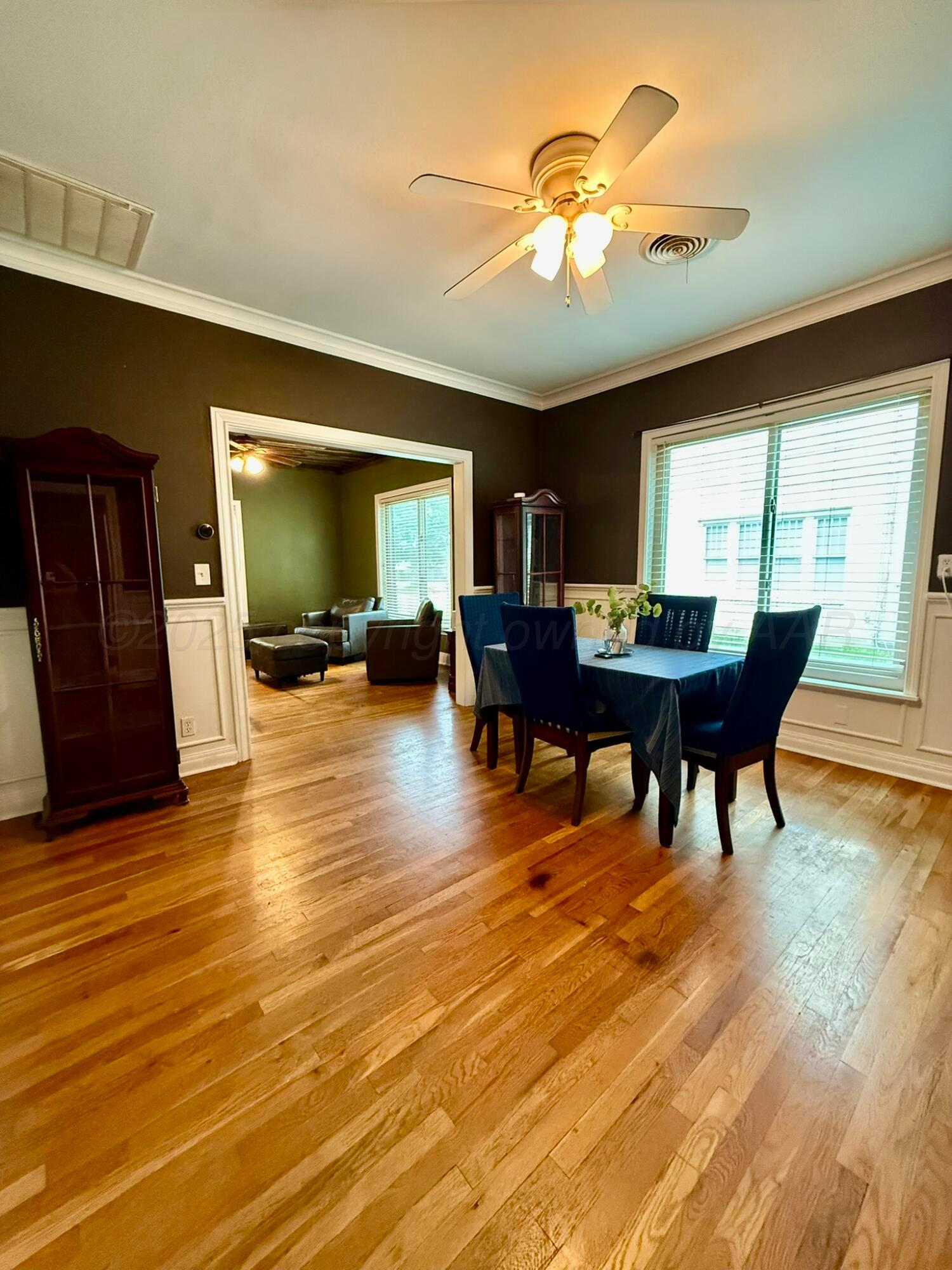 3314 Kingston Road Amarillo, TX 79106 - Photo 7 of 17 a view of a dining room with furniture and wooden floor