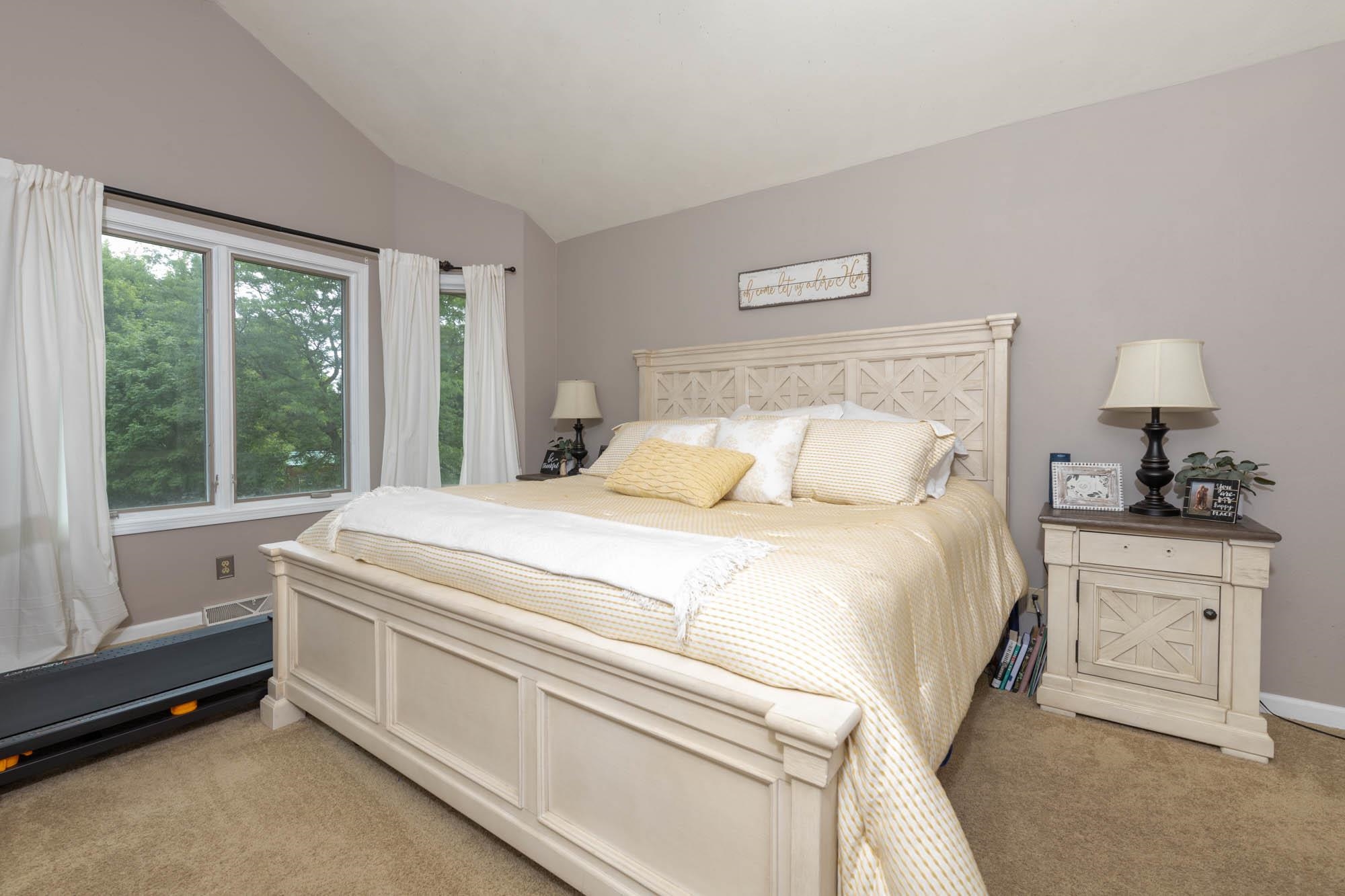 10023 Tybow Trail Roscoe, IL 61073 - Photo 12 of 20 a bedroom with a bed and a window