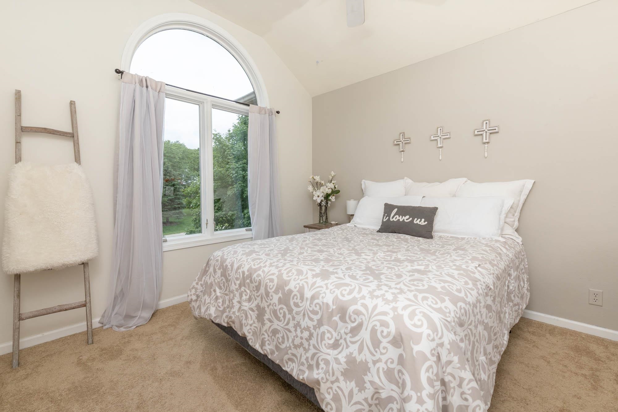 10023 Tybow Trail Roscoe, IL 61073 - Photo 14 of 20 a bedroom with a bed and a window