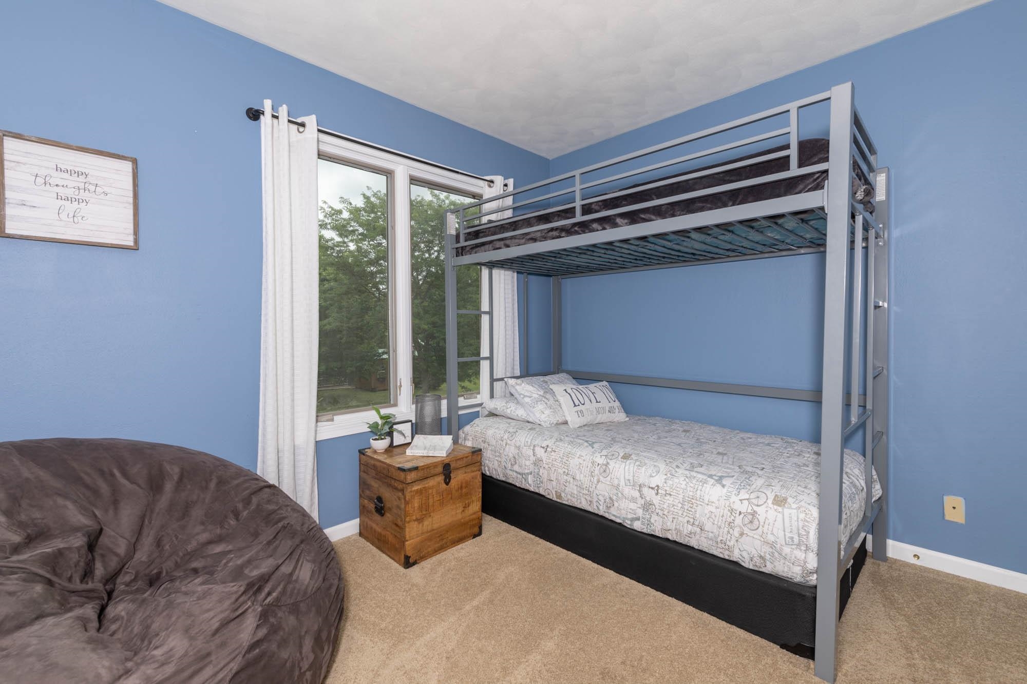 10023 Tybow Trail Roscoe, IL 61073 - Photo 16 of 20 a bedroom with a bed and a window