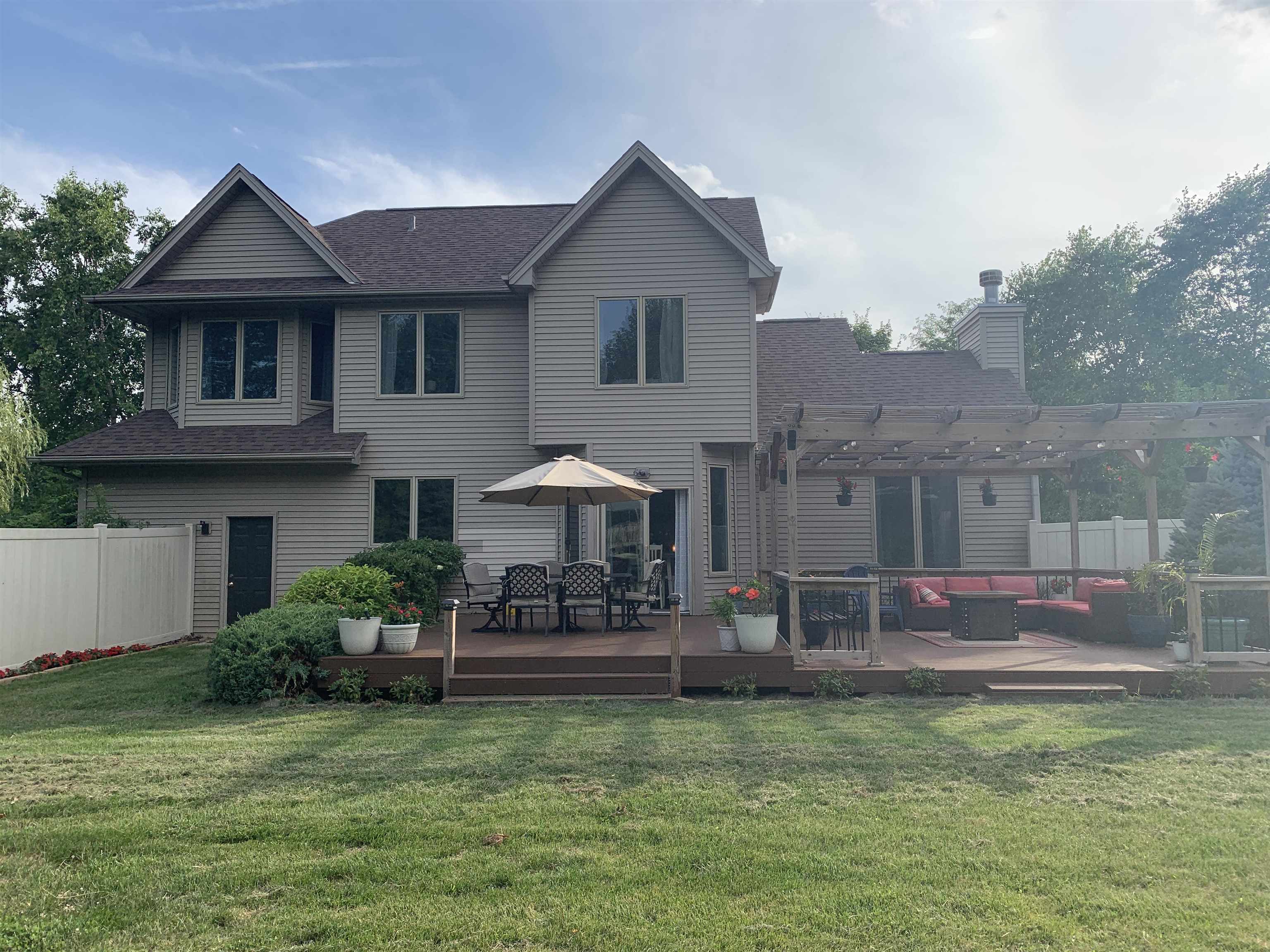 10023 Tybow Trail Roscoe, IL 61073 - Photo 2 of 20 a view of a house with a yard