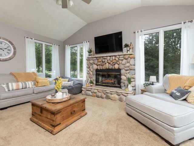 10023 Tybow Trail Roscoe, IL 61073 - Photo 3 of 20 a living room with furniture fireplace and a large window