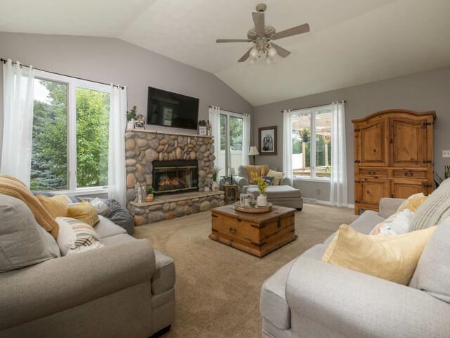 10023 Tybow Trail Roscoe, IL 61073 - Photo 4 of 20 a living room with furniture fireplace and a large window