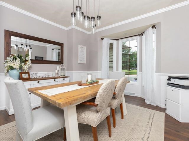 10023 Tybow Trail Roscoe, IL 61073 - Photo 5 of 20 a view of a dining room with furniture and wooden floor
