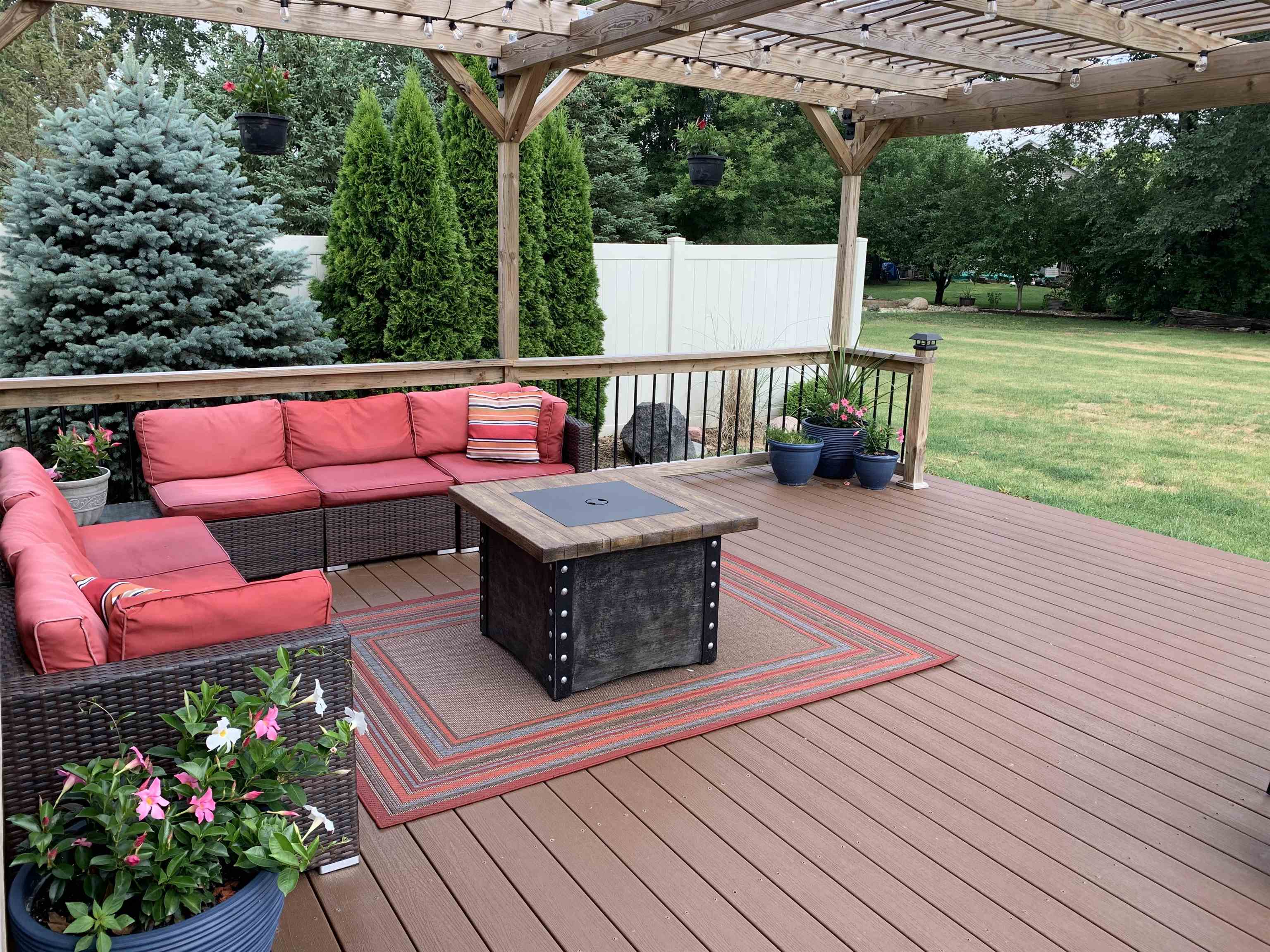 10023 Tybow Trail Roscoe, IL 61073 - Photo 8 of 20 a view of a chairs and table on the wooden roof deck