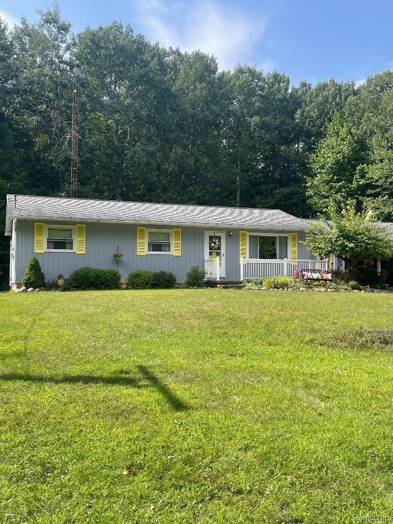 1866 South Barrie Road Bad Axe, MI 48413 - Photo 1 of 42 Ranch-style residence featuring a light grey exterior with yellow window shutters and a white front door