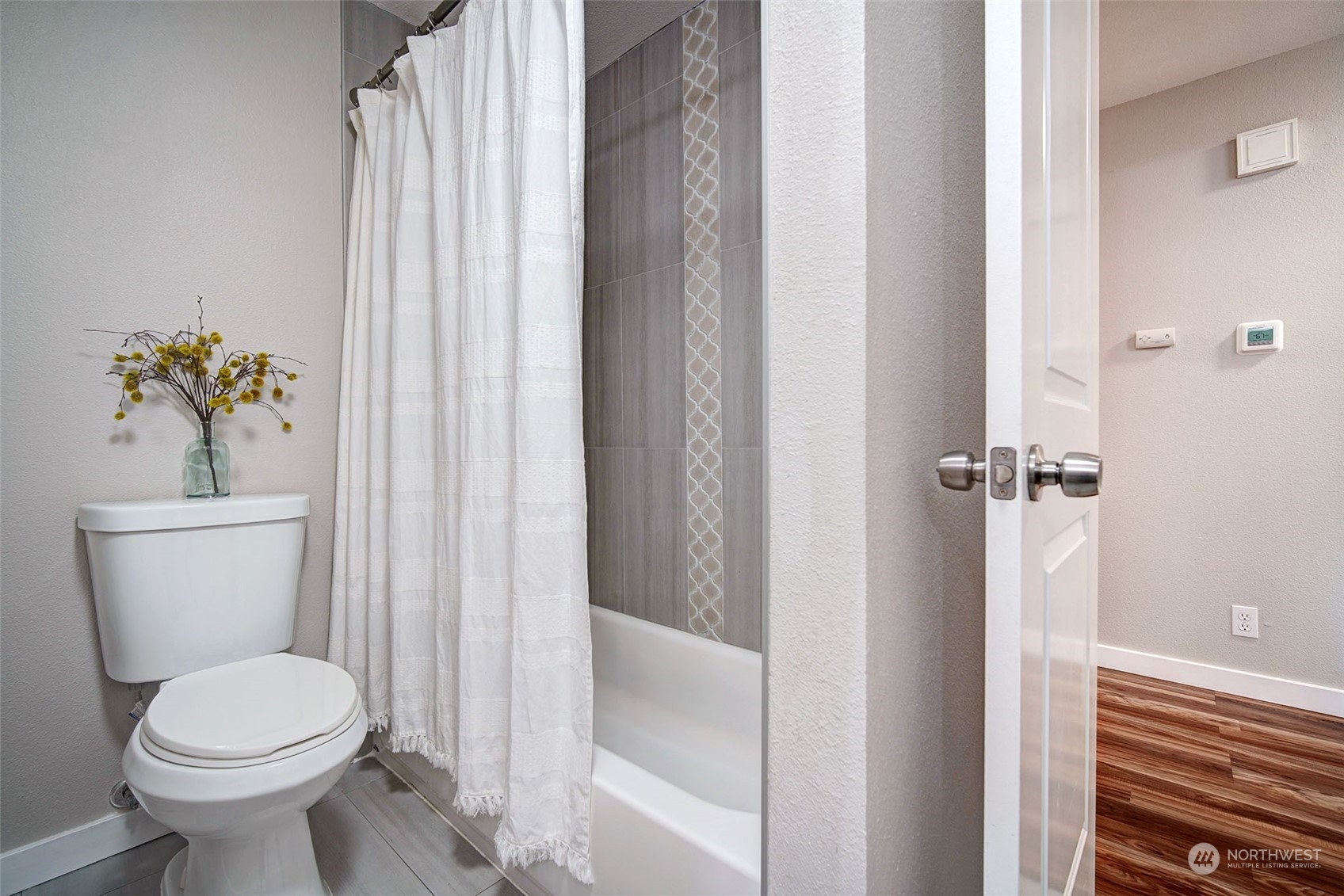 9504 233rd Street Southwest Edmonds, WA 98020 - Photo 18 of 26 a bathroom with a sink and toilet
