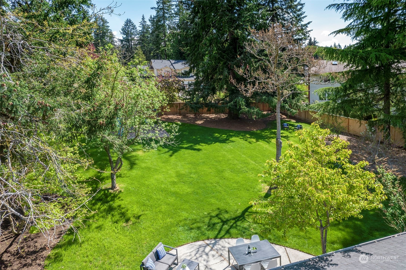 9504 233rd Street Southwest Edmonds, WA 98020 - Photo 24 of 26 a backyard of a house with lots of green space