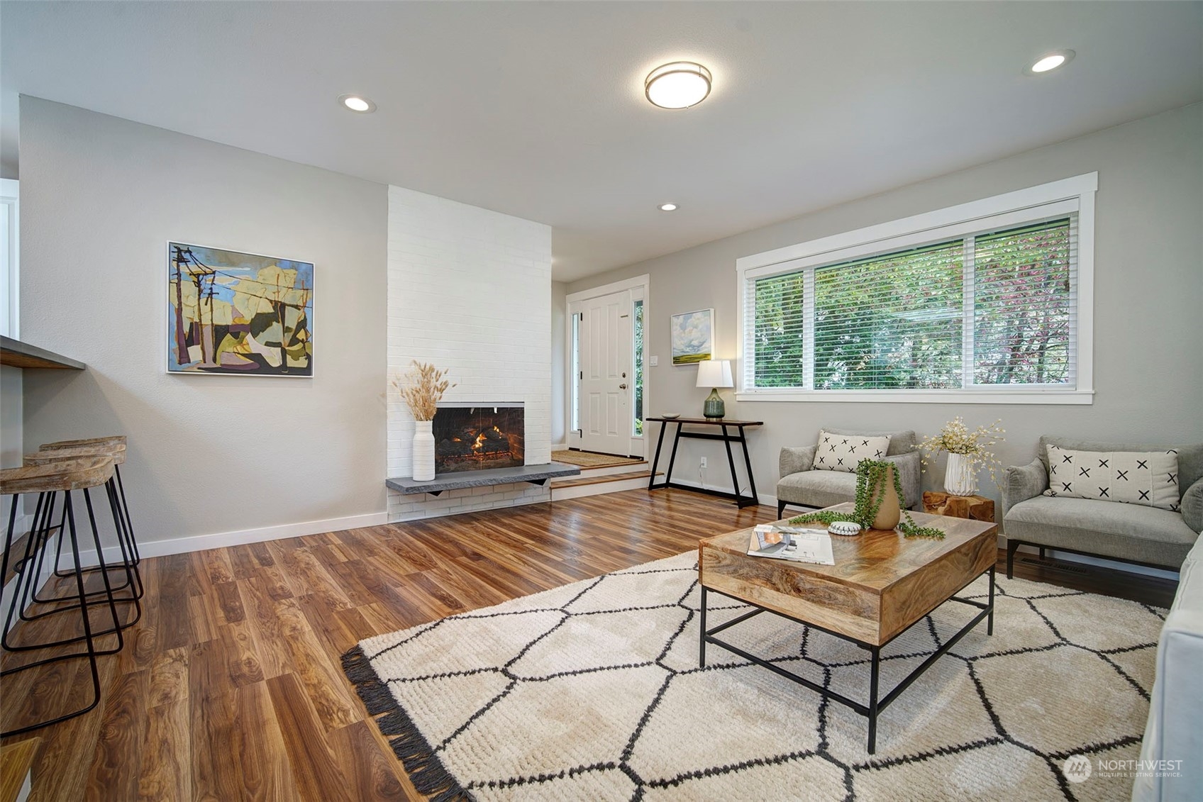 9504 233rd Street Southwest Edmonds, WA 98020 - Photo 3 of 26 a living room with furniture and a fireplace