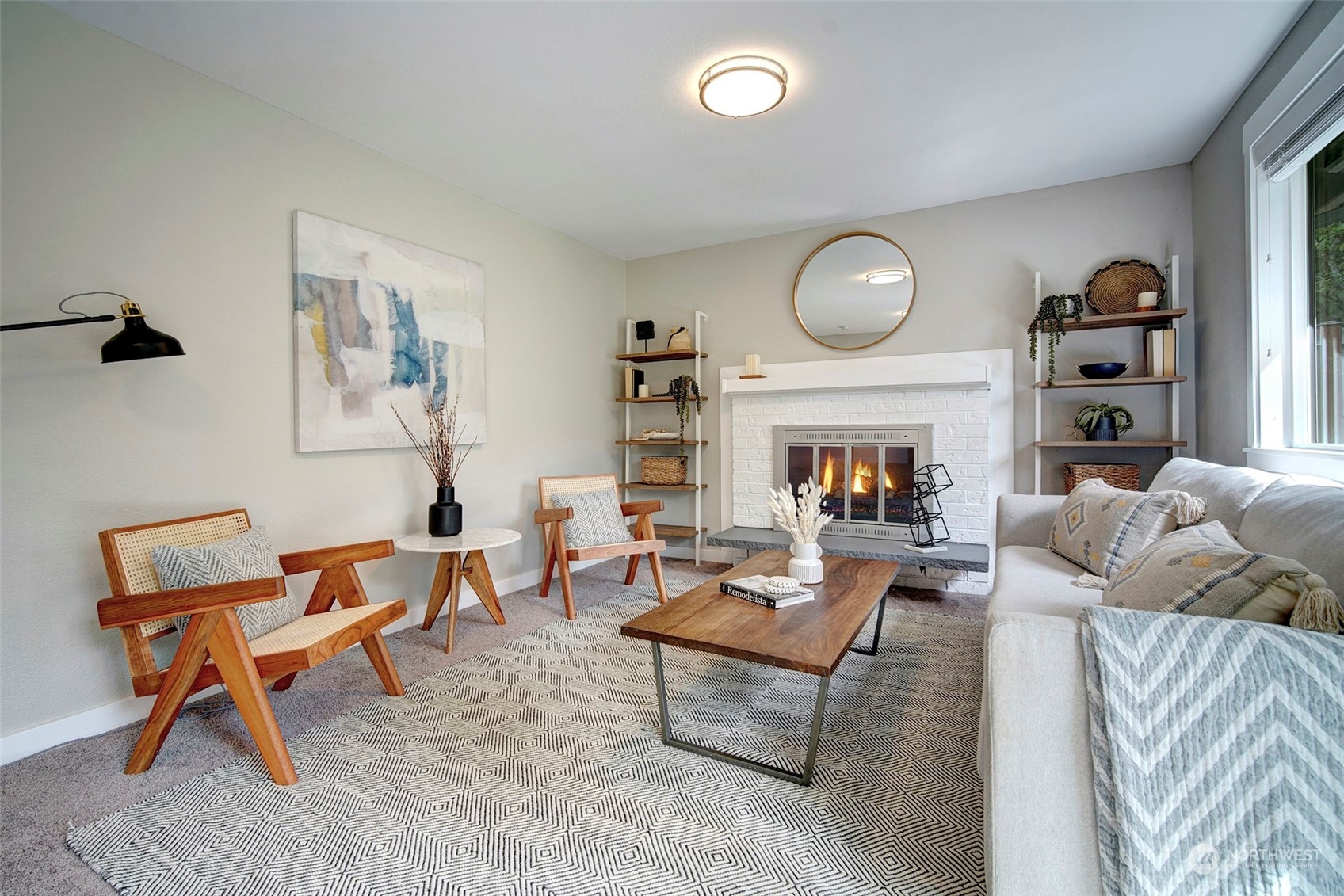9504 233rd Street Southwest Edmonds, WA 98020 - Photo 9 of 26 a living room with furniture and a fireplace