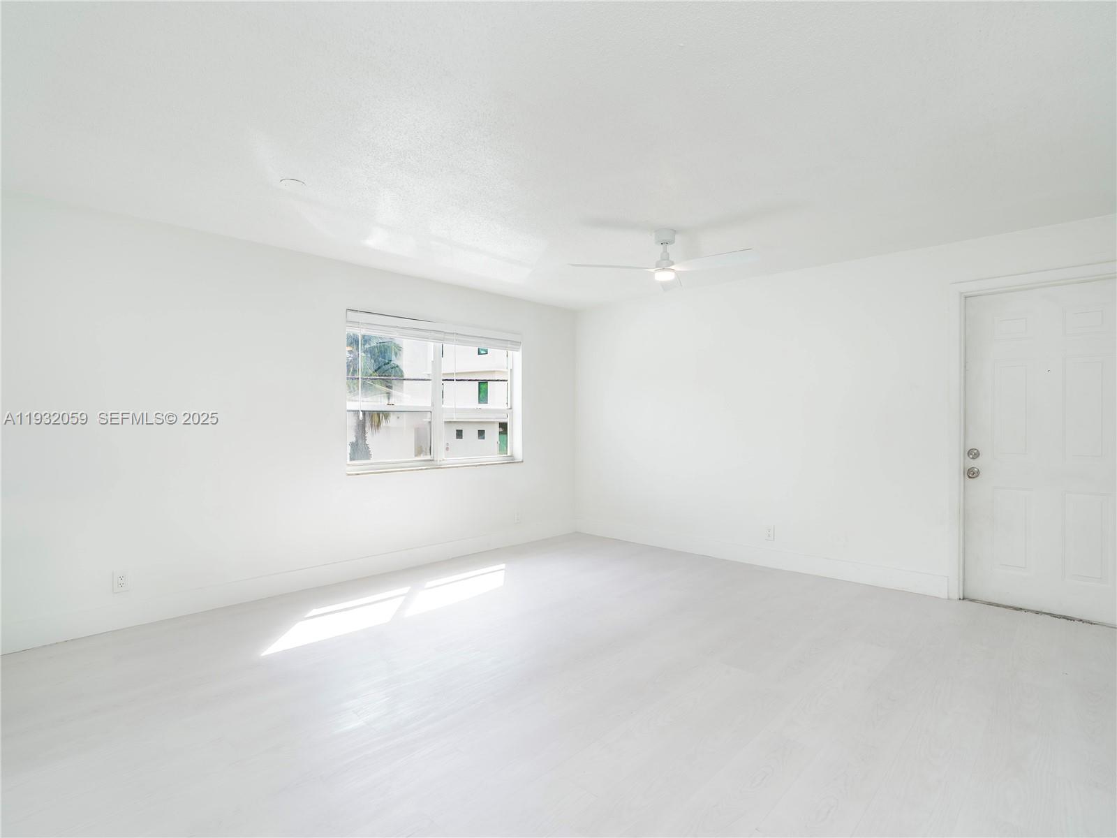 2025 Miami Road, Unit 17 Fort Lauderdale, FL 33316 - Photo 5 of 23 an empty room with windows