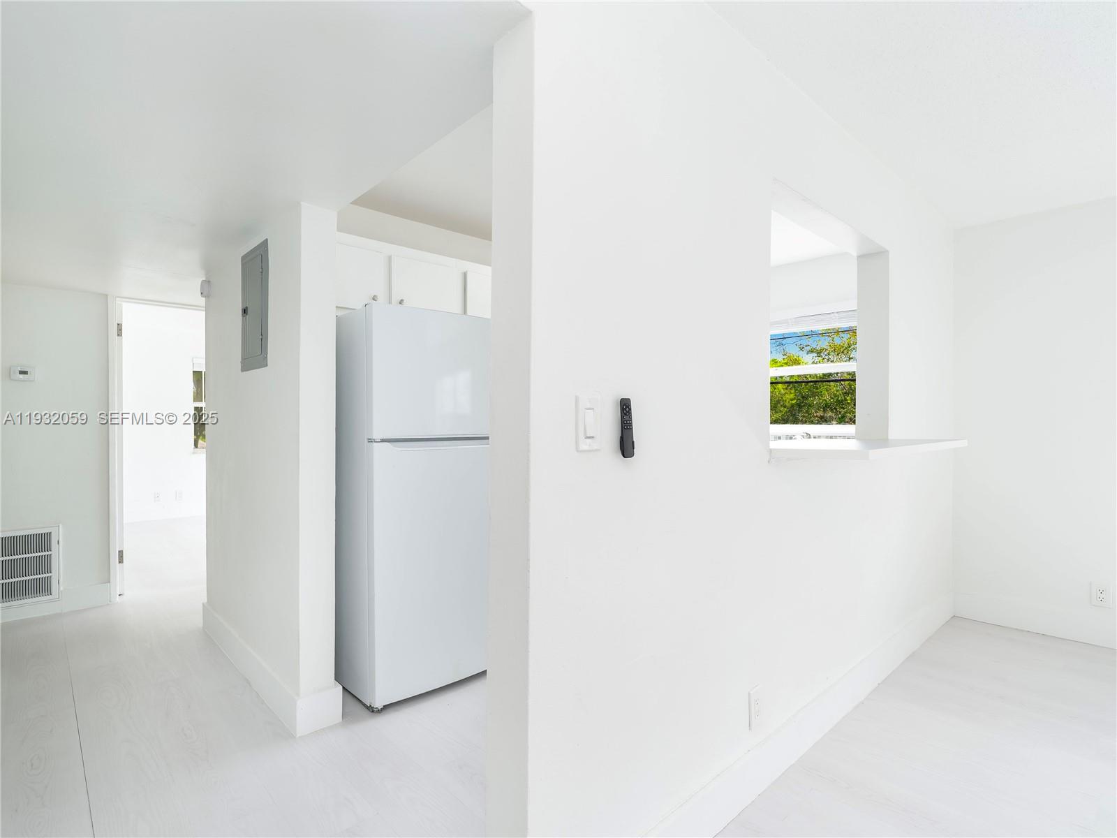 2025 Miami Road, Unit 17 Fort Lauderdale, FL 33316 - Photo 6 of 23 a view of a kitchen with a refrigerator and a refrigerator