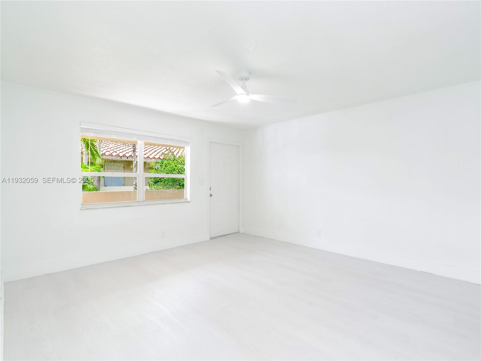 2025 Miami Road, Unit 17 Fort Lauderdale, FL 33316 - Photo 10 of 23 an empty room with windows