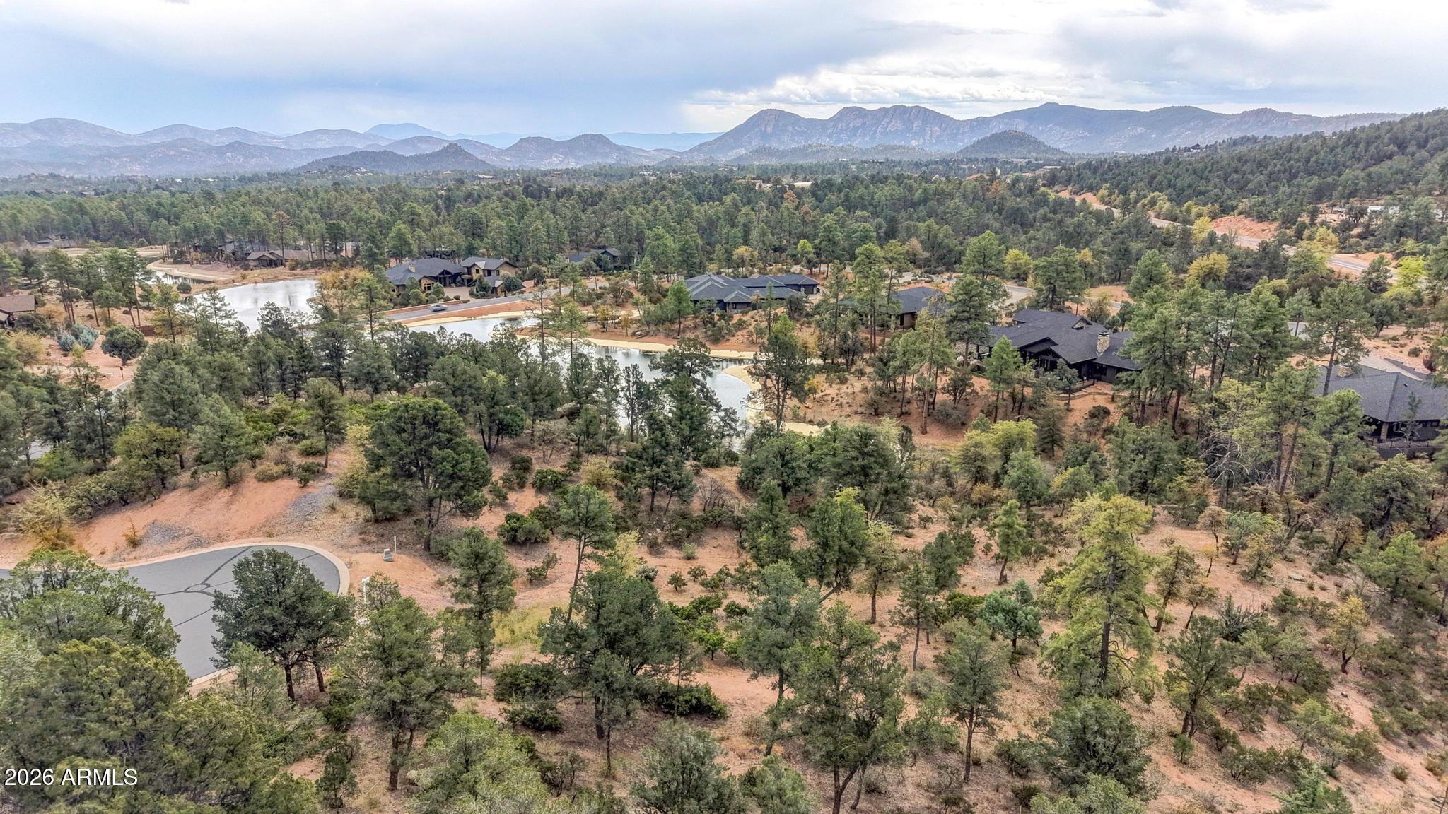 1701 East Redbud Court, Unit 879 Payson, AZ 85541 - Photo 8 of 12 an aerial view of residential houses with outdoor space and mountain view