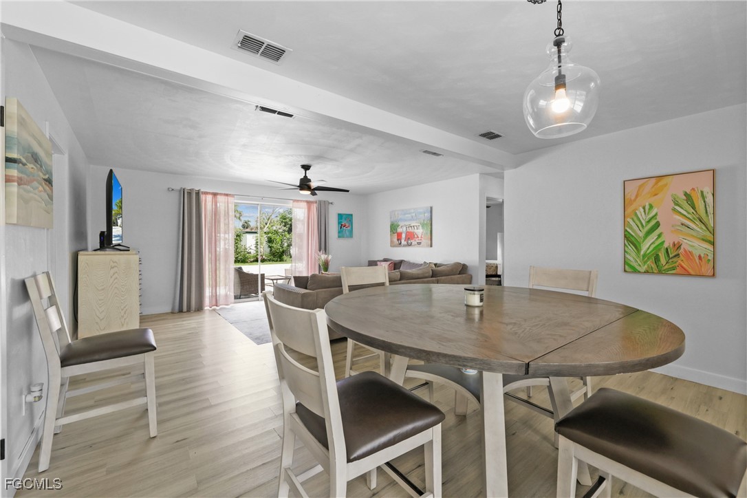 1661 Coronado Road Fort Myers, FL 33901 - Photo 11 of 50 a view of a dining room with furniture and wooden floor
