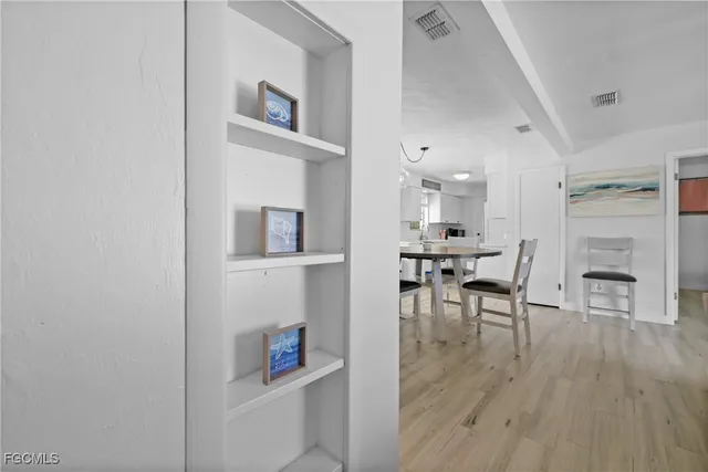 a view of a livingroom with furniture and wooden floor