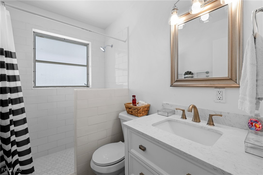 1661 Coronado Road Fort Myers, FL 33901 - Photo 20 of 50 a bathroom with a sink and a mirror