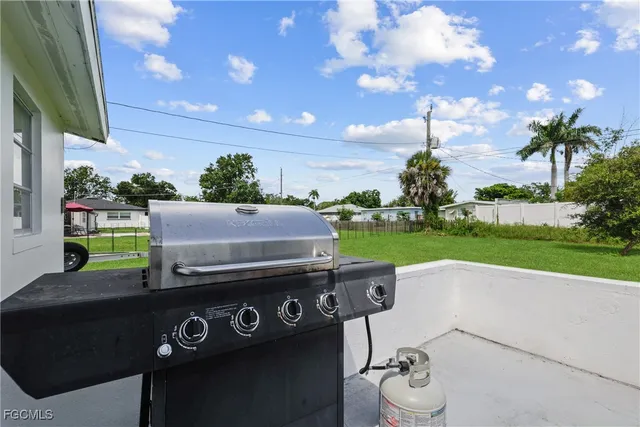 a view of a chairs and table in backyard