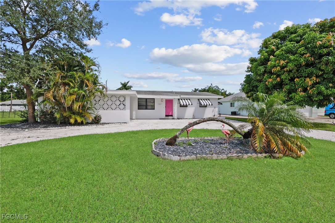 1661 Coronado Road Fort Myers, FL 33901 - Photo 28 of 50 a aerial view of a house with a yard and sitting area