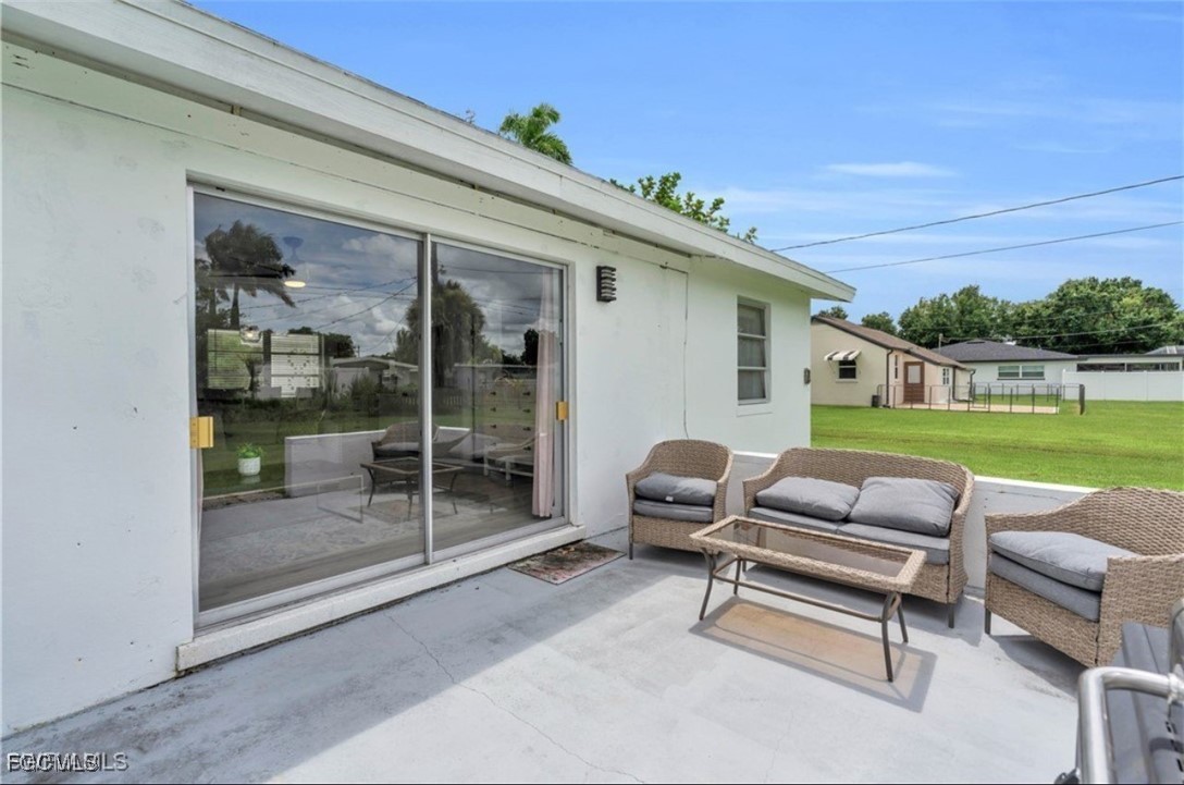 1661 Coronado Road Fort Myers, FL 33901 - Photo 40 of 50 a outdoor living space with furniture and a garden