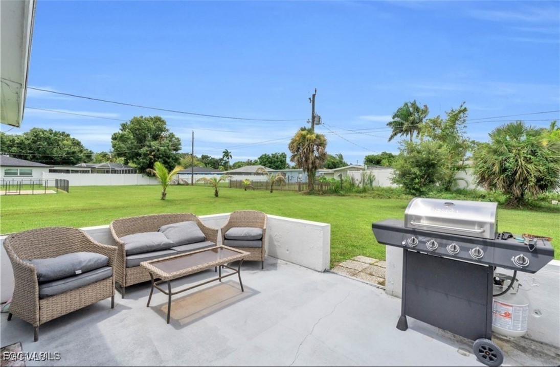 1661 Coronado Road Fort Myers, FL 33901 - Photo 41 of 50 a view of a garden with couches in a patio