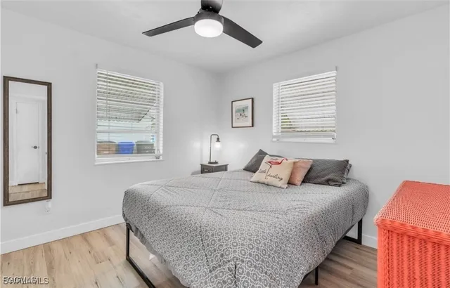 a bedroom with bed and a window