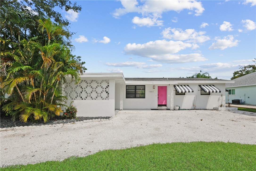 1661 Coronado Road Fort Myers, FL 33901 - Photo 5 of 50 a view of a house with a yard