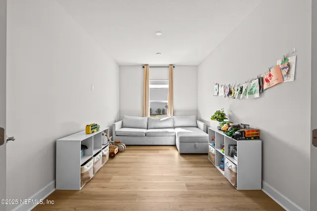 a room with furniture and a wooden floor