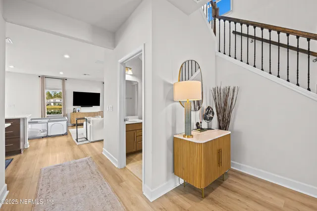 a view of living room with furniture and flat screen tv