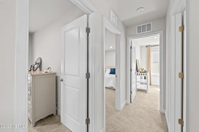 a view of a bathroom with a sink and mirror