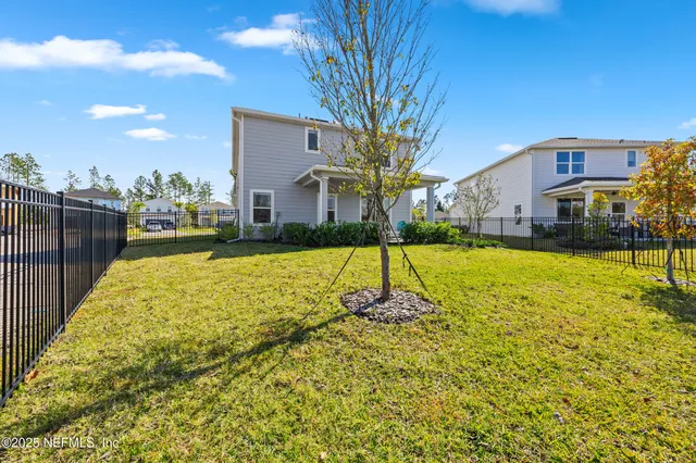 a view of a house with a big yard
