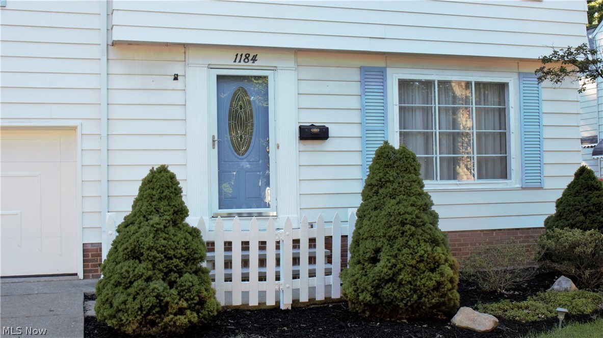 1184 Gordon Road Lyndhurst, OH 44124 - Photo 20 of 22 Front entrance with newer front steps and landscaping.