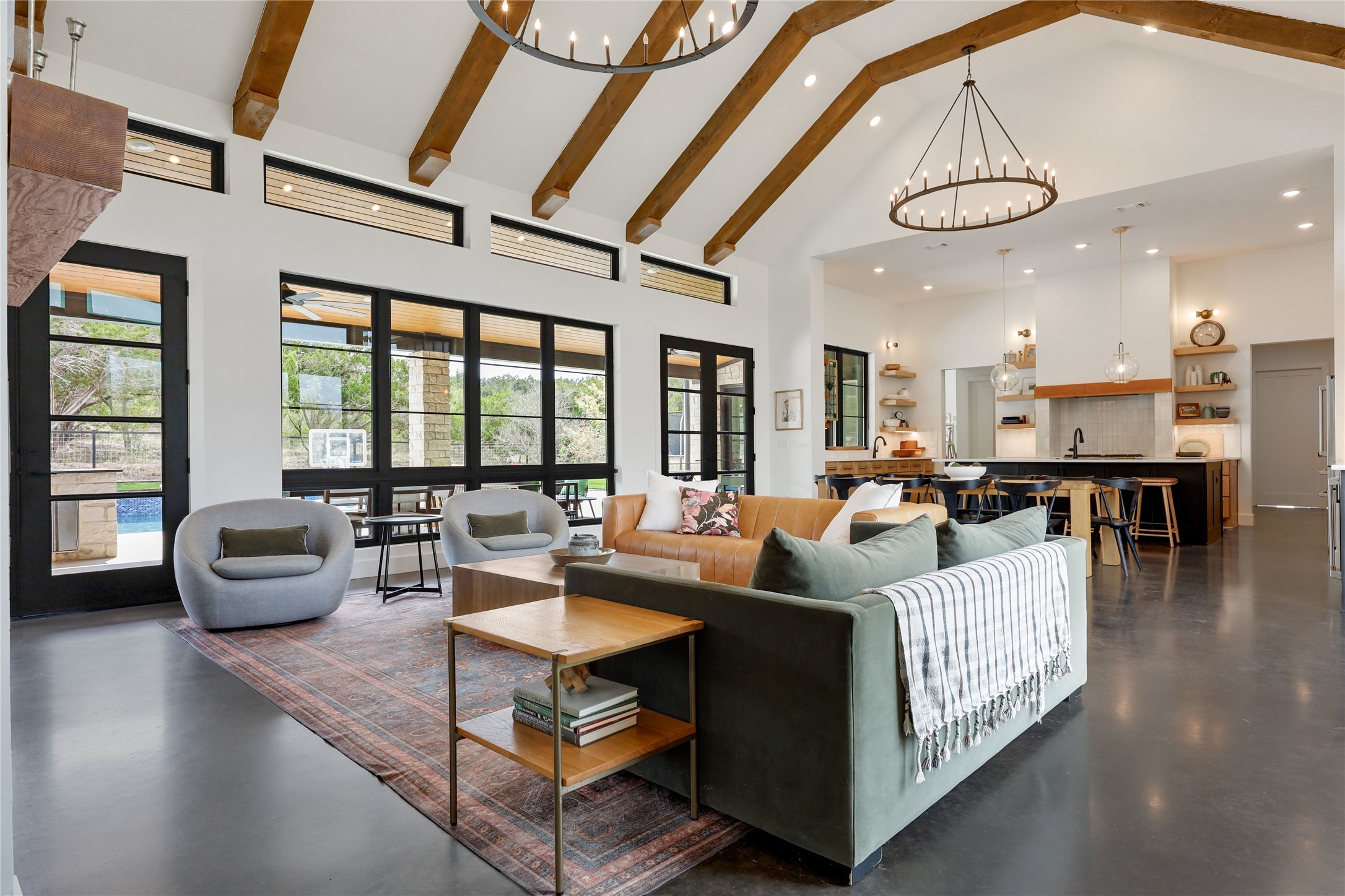 329 Calvary Cove Dripping Springs, TX 78620 - Photo 12 of 40 a living room with fireplace furniture and a large window