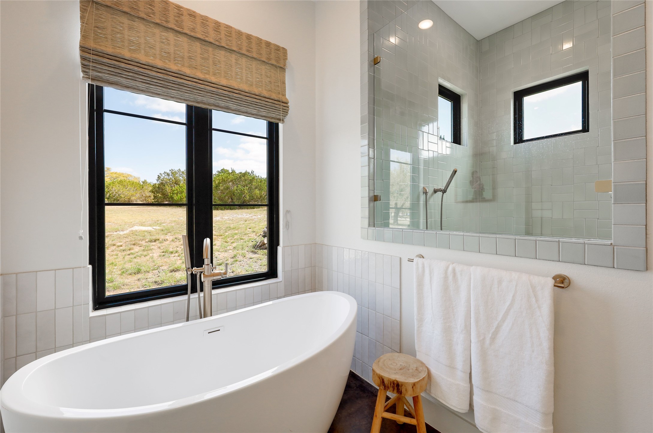 329 Calvary Cove Dripping Springs, TX 78620 - Photo 16 of 40 a white bath tub sitting next to a window