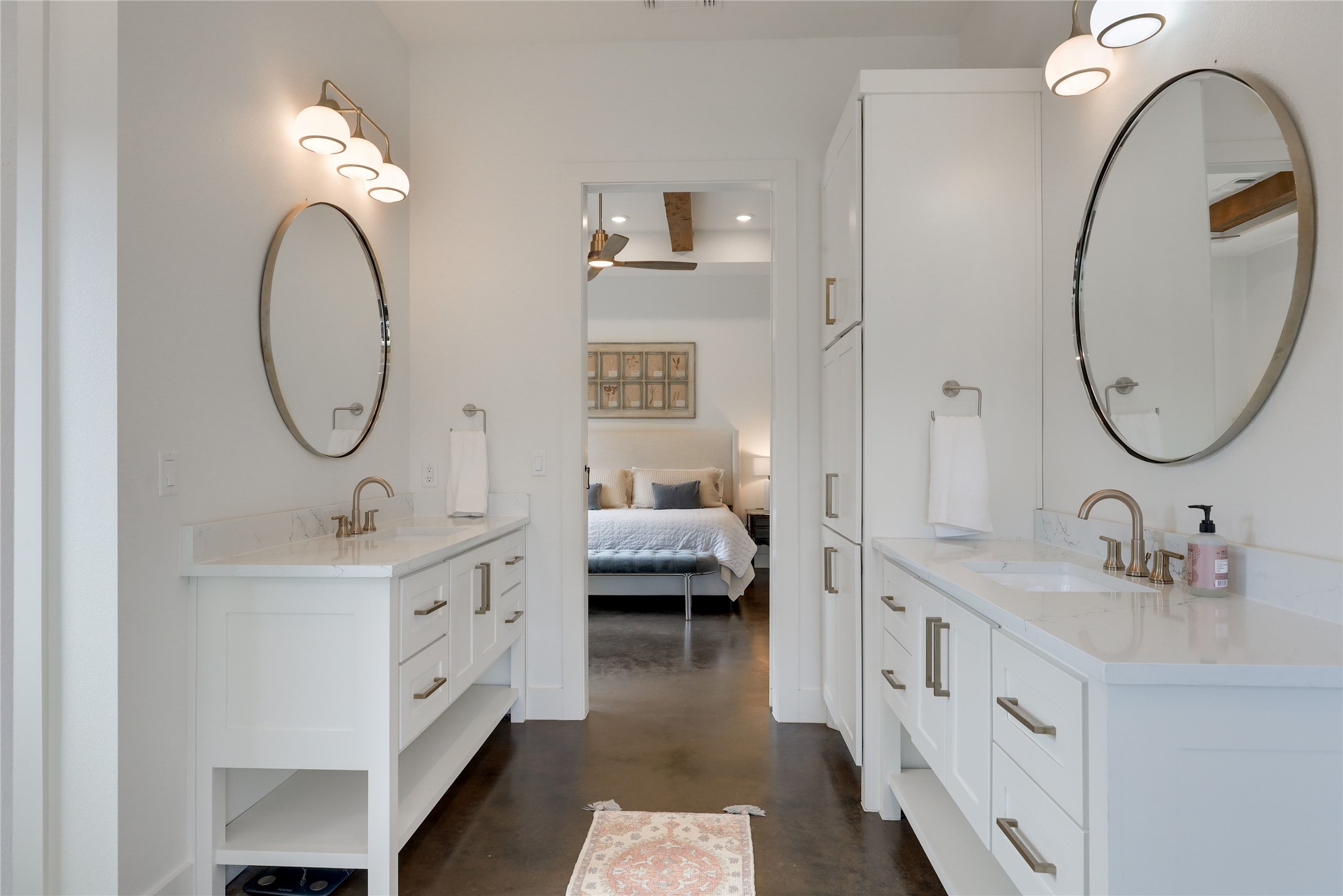 329 Calvary Cove Dripping Springs, TX 78620 - Photo 17 of 40 a en suite bathroom with a double vanity sink and a mirror