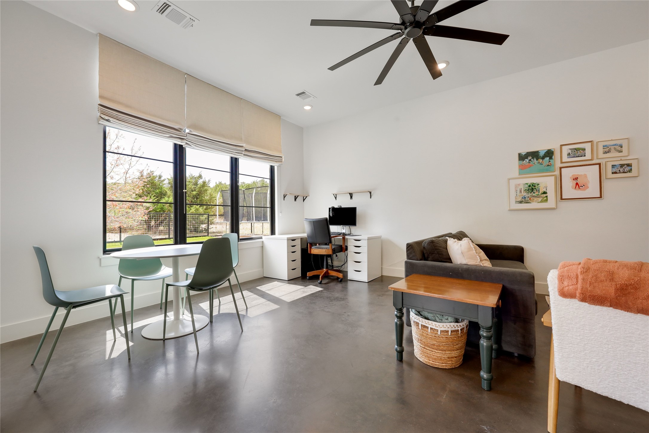 329 Calvary Cove Dripping Springs, TX 78620 - Photo 19 of 40 a living room with furniture and a large window