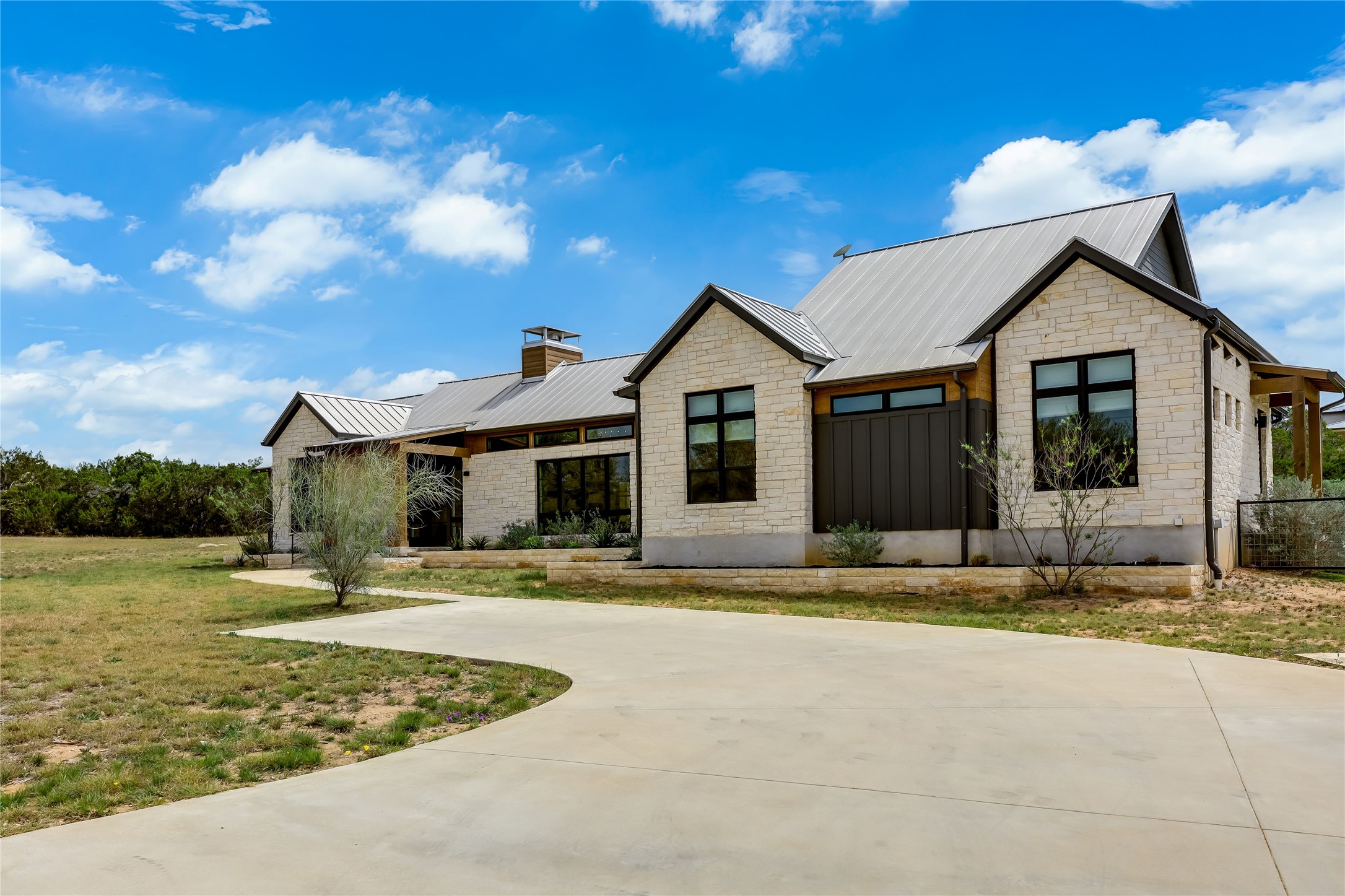 329 Calvary Cove Dripping Springs, TX 78620 - Photo 2 of 40 a view of a house with a yard