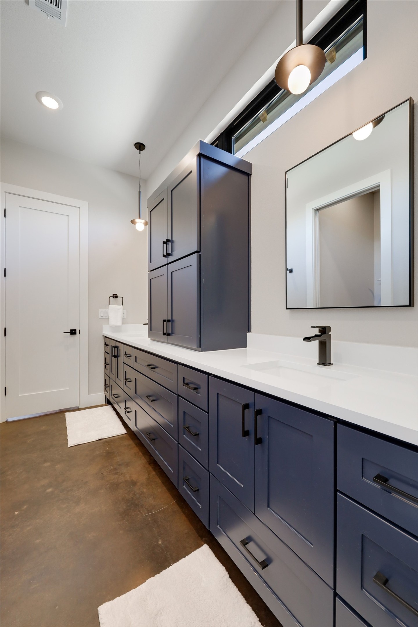 329 Calvary Cove Dripping Springs, TX 78620 - Photo 24 of 40 a spacious bathroom with a double vanity sink and a large mirror