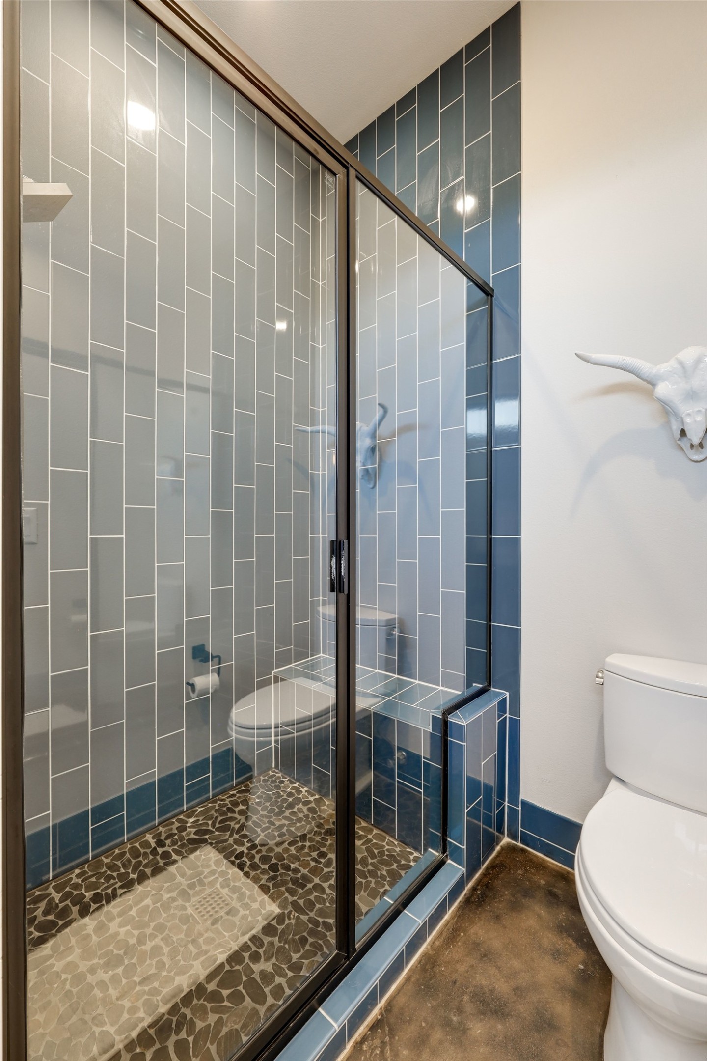 329 Calvary Cove Dripping Springs, TX 78620 - Photo 25 of 40 a bathroom with a toilet and shower
