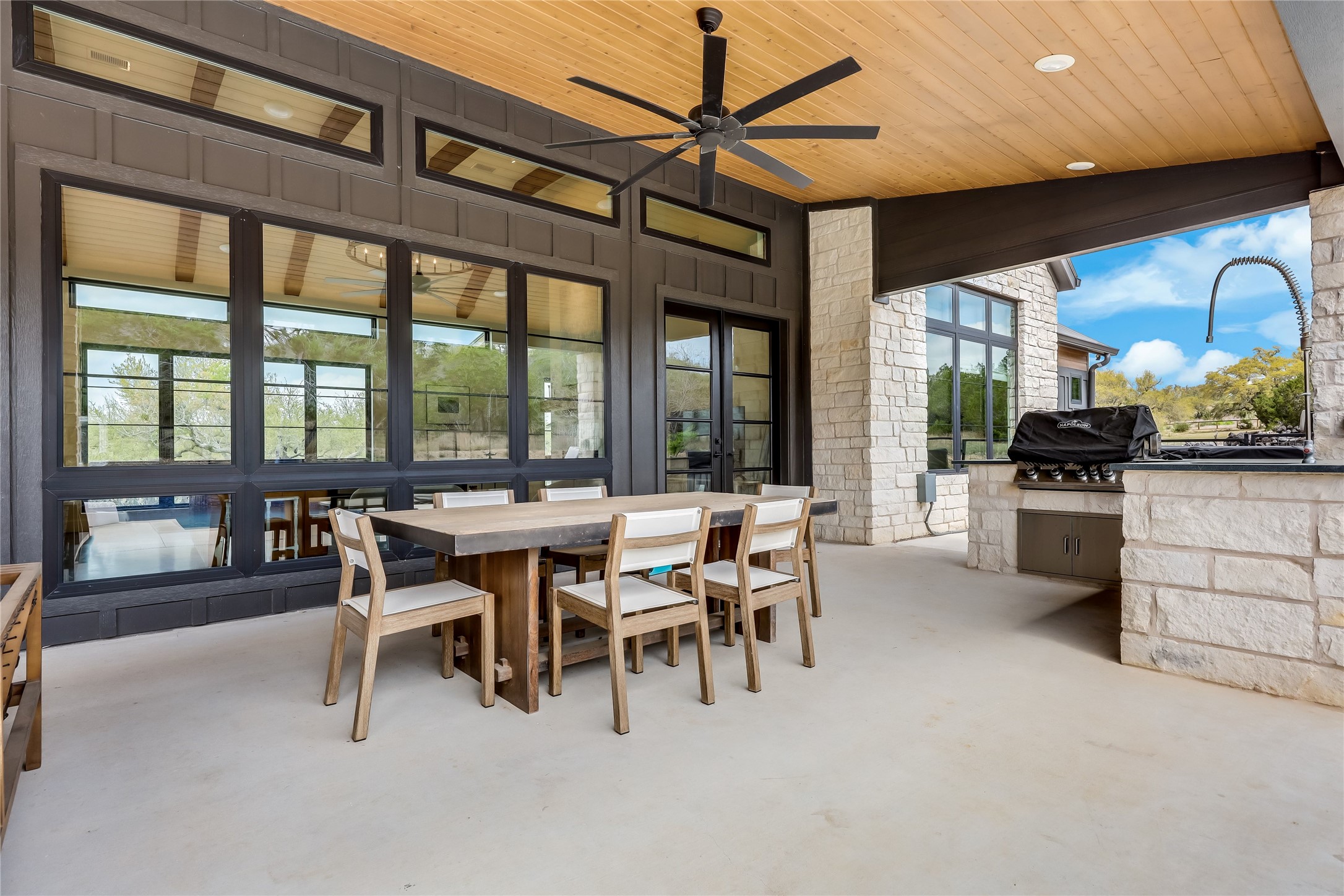 329 Calvary Cove Dripping Springs, TX 78620 - Photo 32 of 40 a dining area with furniture and a large window