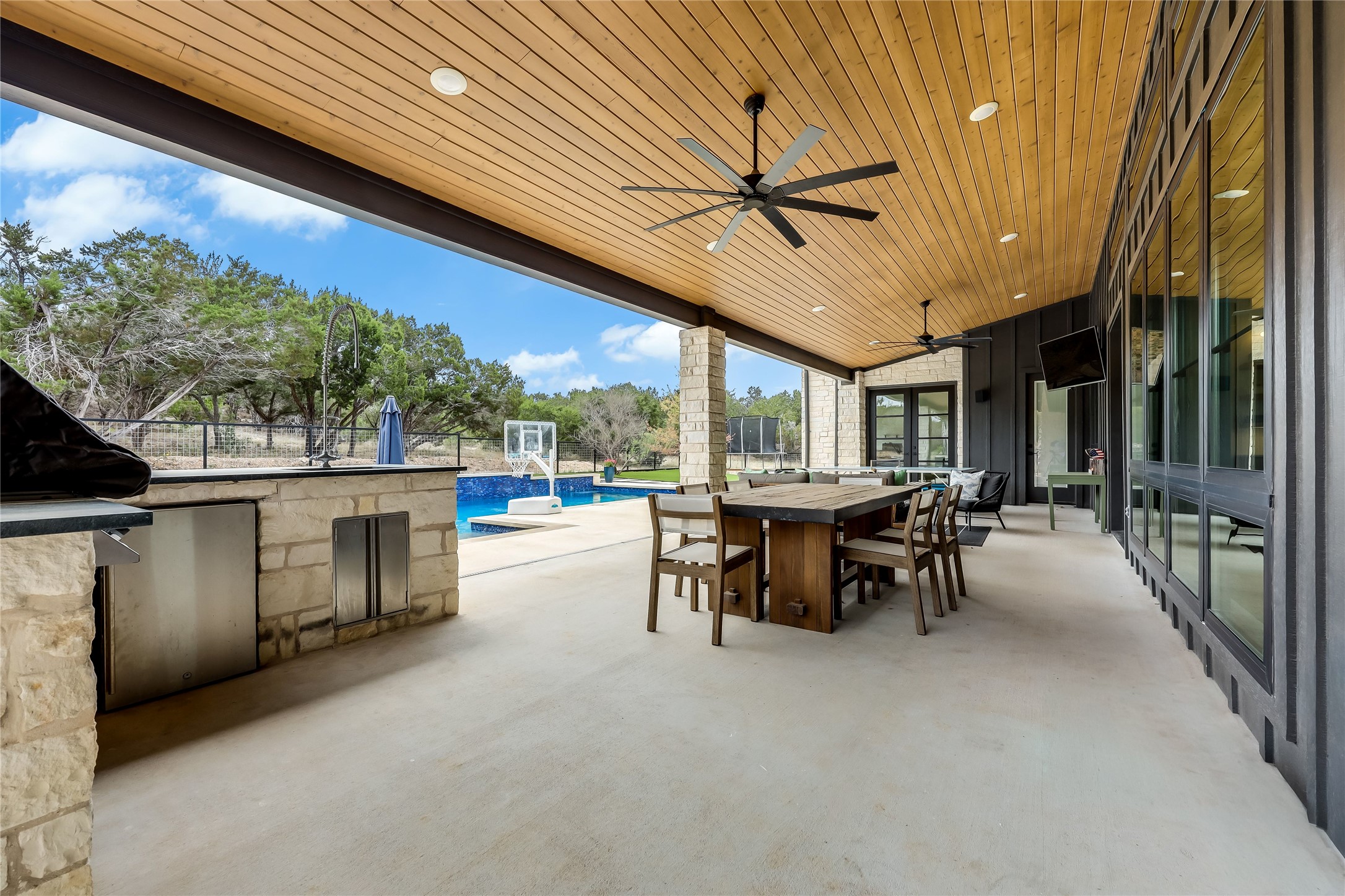 329 Calvary Cove Dripping Springs, TX 78620 - Photo 33 of 40 a view of a patio with a table and chairs