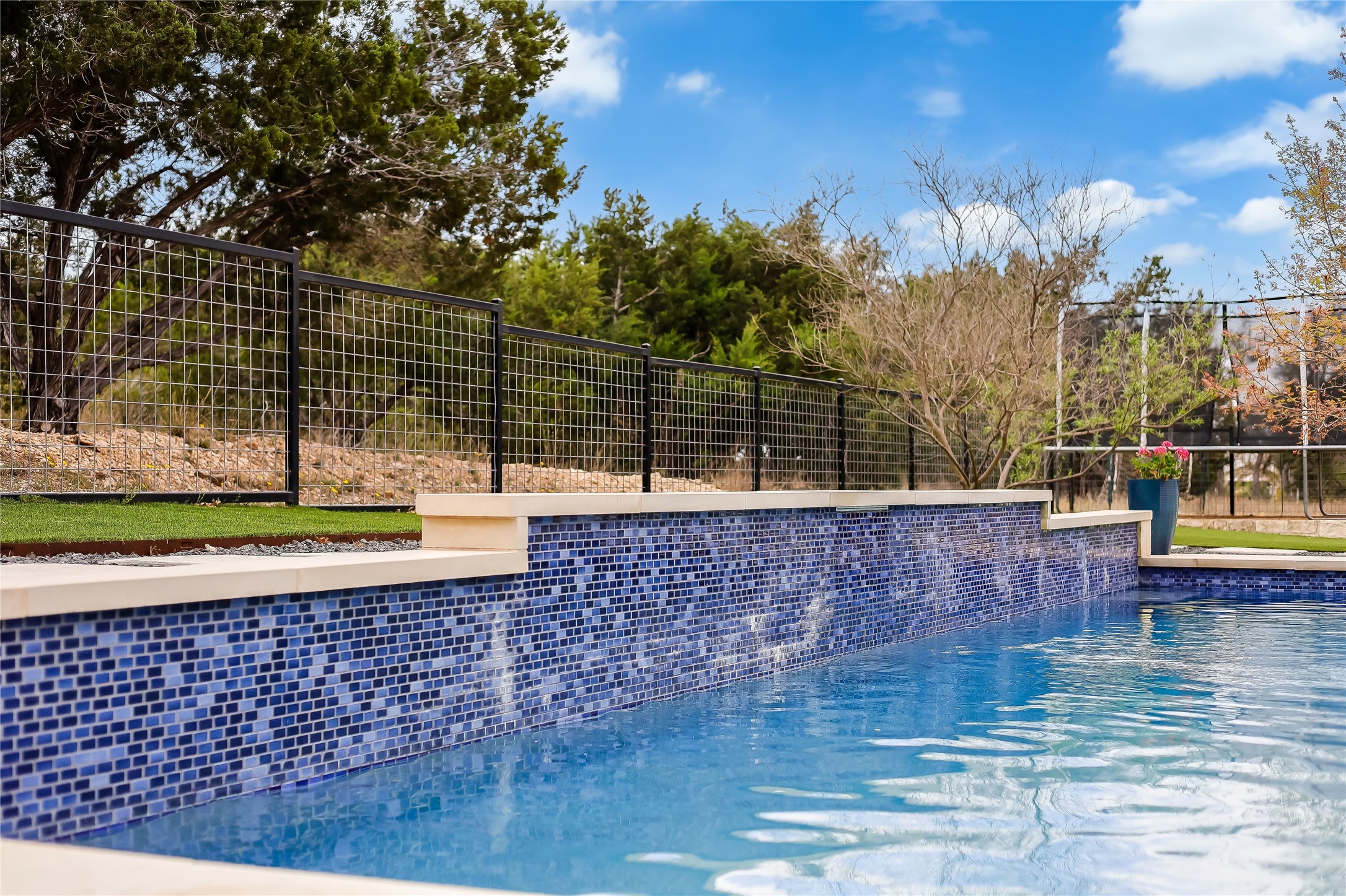 329 Calvary Cove Dripping Springs, TX 78620 - Photo 35 of 40 a view of roof deck with a barbeque and wooden stairs