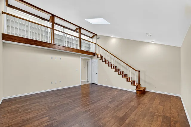a view of an entryway with wooden floor