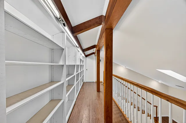 a view of an entryway and hall with wooden floor